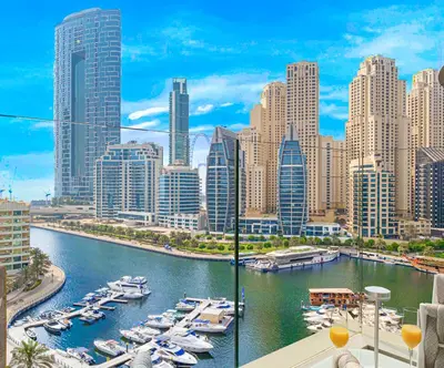 a view of a harbor with boats in a city at LUXE Rooftop Infinity Pool 5 Mins to JBR Dubai Marina View in Dubai