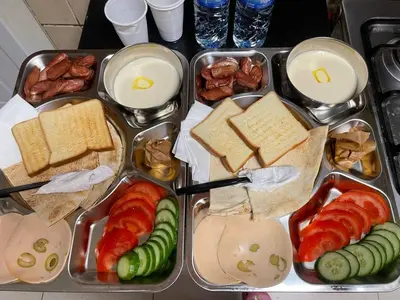 a tray filled with different types of food on a table at Lotel Al Barsha 1 at the Mall in Dubai