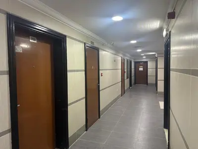 a hallway of elevators in an office building at Lotel Al Barsha 1 at the Mall in Dubai