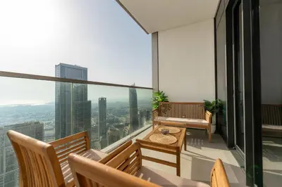 a balcony with benches and a view of the city at Grande Signature Residence by Hogar in Dubai