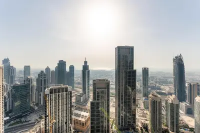 an aerial view of a city with tall buildings at Grande Signature Residence by Hogar in Dubai