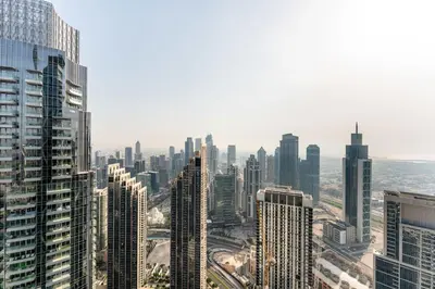 an aerial view of a city with tall buildings at Grande Signature Residence by Hogar in Dubai