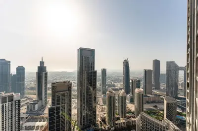 an aerial view of a city with tall buildings at Grande Signature Residence by Hogar in Dubai