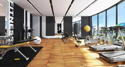 a gym with treadmills and exercise equipment in a room at Modern 2BR Apartment Nobles Tower Dubai Views in Dubai