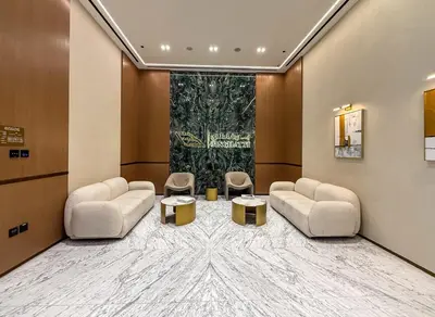 a waiting room with two couches and two tables at Luxury 1BR Apt Binghatti Amber Prime Location in Dubai
