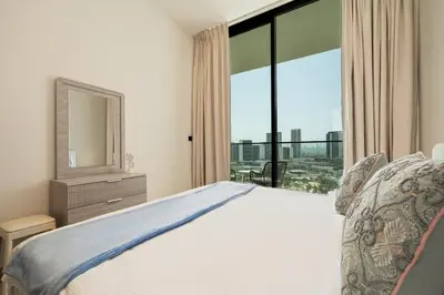 a bedroom with a bed and a large window at Luxury 1BR Apt Binghatti Amber Prime Location in Dubai