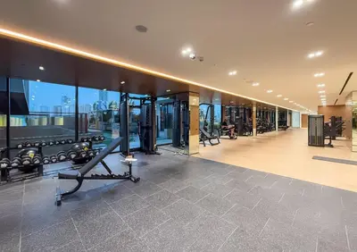 a gym with a treadmill in a building at Stylish Comfort Modern 1BR Apt Prime Location JVC in Dubai