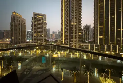 a view of a city skyline at night at Elegant Style Brand new 2BDR in Heart of Downtown in Dubai