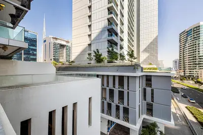 a view of a building in a city at Stylish Studio With Pool View Mins to Dubai Mall in Dubai
