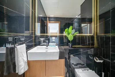 a bathroom with a sink and a toilet at Comfortable 1-Bedroom Getaway Binghatti House in Dubai