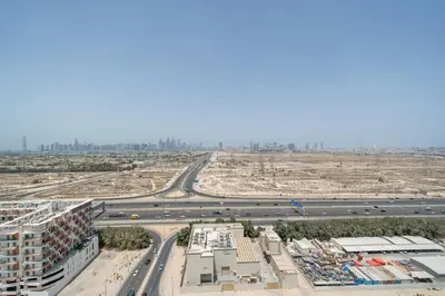 an aerial view of a highway and a city at Skyline Views from Binghatti House in Dubai