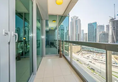 an office building balcony with a view of a city at Stylish Studio Steps from Burj Khalifa Fountains in Dubai