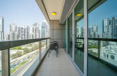 a balcony in a building with a view of a city at Stylish Studio Steps from Burj Khalifa Fountains in Dubai
