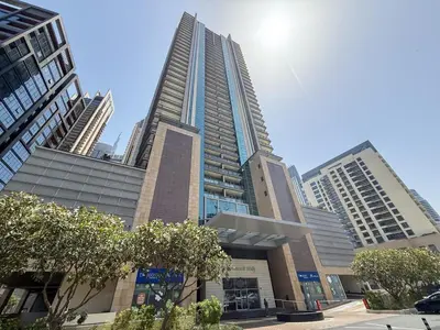a group of tall buildings in a city at Stylish Studio Steps from Burj Khalifa Fountains in Dubai
