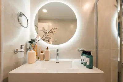 a bathroom with a sink and a mirror at Keyrock - Dubai Marina Apartment with Stunning Sea View, Pool, Gym & Free Parking in Dubai