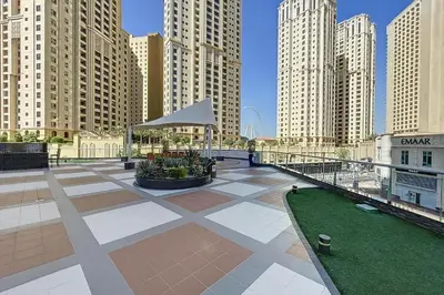 a large plaza in a city with tall buildings at Keyrock - Dubai Marina Apartment with Stunning Sea View, Pool, Gym & Free Parking in Dubai