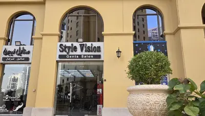 a store front with a sign for a style vision crisis station at Spacious 2 Bedroom in JBR with beach access in Dubai