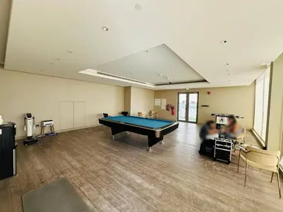 a large room with a pool table in it at Cozy 1br in Sobha Creek Vistas Creek Sea View in Dubai