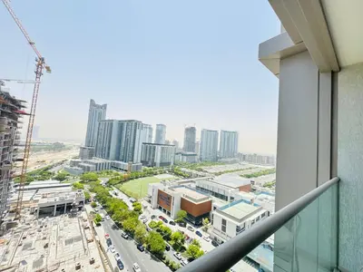 a view of a city from a balcony at Cozy 1br in Sobha Creek Vistas Creek Sea View in Dubai