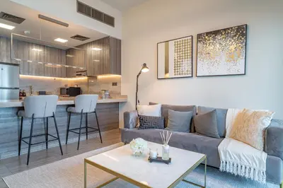 a living room with a couch and a table at MBL Lake VIEW 1 BR in Dubai