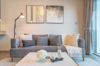 a living room with a couch and a table at MBL Lake VIEW 1 BR in Dubai