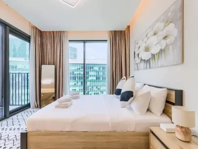 a bedroom with a large white bed with a large window at TRPS - Ahad Residences, Business Bay - Full Burj Khalifa View - Modern Furnished Studio in Dubai