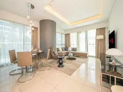 a living room with a couch and a table at Elegant 2 Bedroom Apartment with Pool Views at Business Bay 211DPA-2 in Dubai