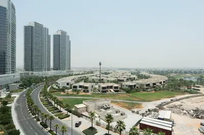 an aerial view of a city with tall buildings at Keyrock Golf Gate - Damac Hills Apartment with Pool, Gym & Free Parking in Dubai