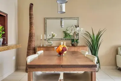 a dining room table with a bowl of fruit on it at DAYF-BVE Large 1BR in Downtown Steps to Dubai Mall in Dubai