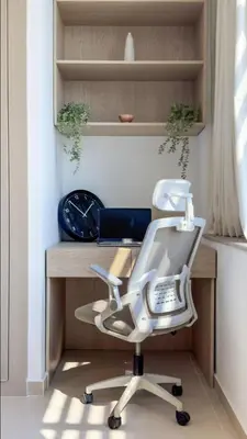 a white desk with a chair and a clock at DAYF-SKG High Floor Studio in Sky Gardens Heart of DIFC in Dubai