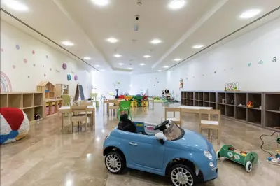 a room with a blue car with a dog in it at DAYF-SKG High Floor Studio in Sky Gardens Heart of DIFC in Dubai