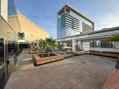 a building with a courtyard in front of a building at DAYF-SKG04 Modern Spacious 1 Bed Full DIFC Views in Dubai