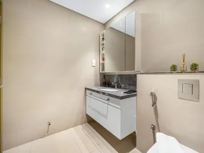 a bathroom with white walls and a sink at Chic 1BR in Downtown Dubai-Direct access to Dubai Mall in Dubai
