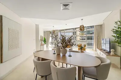 a dining room with a table and chairs at Silkhaus Cityscape 2BR in DIFC Prime location in Dubai