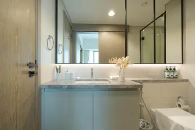 a bathroom with a sink and a mirror at KeyRock Golf Gate - Relax and Unwind with Pool and Sauna in Dubai