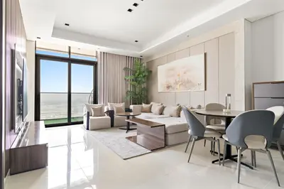a living room with a couch and a table at Nobles tower tiger in Dubai