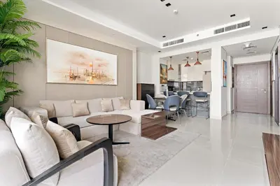 a living room with a couch and a table at Nobles tower tiger in Dubai
