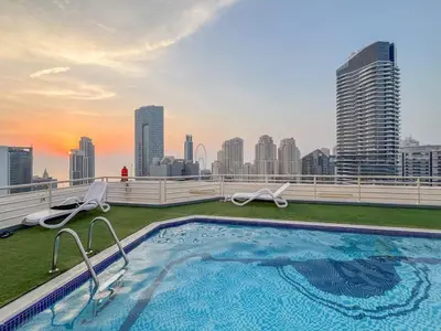 a swimming pool on the roof of a building at Luxury 1 BHK in Dubai Marina By dPie Man 1011 in Dubai