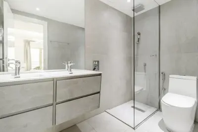 a bathroom with a toilet and a sink and a shower at Luxury 3BR in Dubai Marina Man 2203 in Dubai