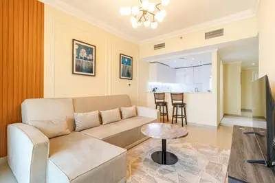 a living room with a couch and a table at Luxury 3BR in Dubai Marina Man 2203 in Dubai