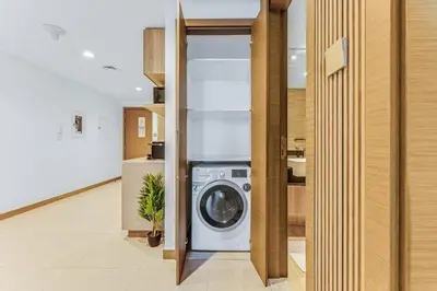a washer and dryer in a laundry room at Elegant 1B Missoni-Near Burj & Dubai Mall in Dubai
