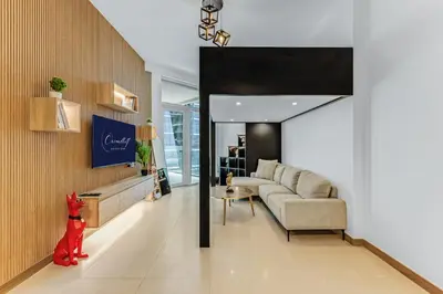 a living room with a couch and a table at Elegant 1B Missoni-Near Burj & Dubai Mall in Dubai
