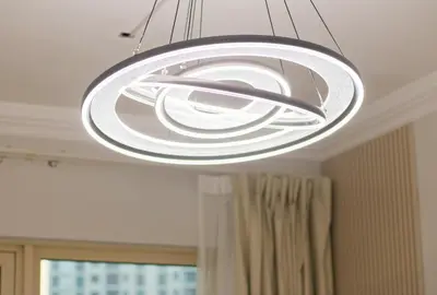 a large light fixture hanging from a ceiling at Luxury 2BR in Dubai Marina Man 405 in Dubai