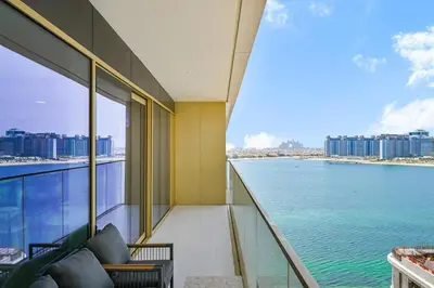 a balcony with a view of the ocean at Golden Stays - Luxury Emaar Beachfront 2BR I Sea & Palm Views in Dubai