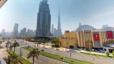 a view of a city with tall buildings and a street at Boulevard Point - One Bed with Burj Khalifa View in Dubai