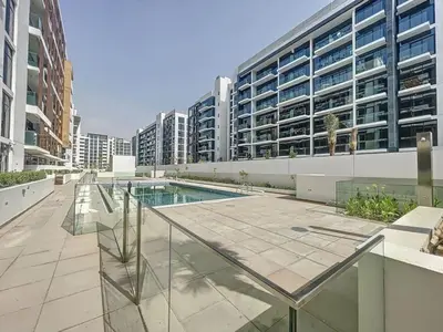 a swimming pool in the middle of a building at Azizi Riviera 18 - Peaceful Studio in Meydan in Dubai
