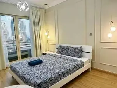 a bedroom with a bed with a blue pillow on it at Luxury 2BR in Dubai Marina Man 912 in Dubai