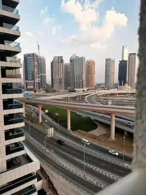 a view of a city with a bridge and buildings at Luxury 2BR in Dubai Marina Man 912 in Dubai