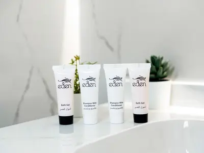 a group of three tubes of cream sitting on a counter at Luxury 3BHK w Floating Bed in Dubai Marina Man 2805 in Dubai