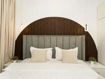 a bed with a large wooden headboard and white pillows at Luxury 3BHK w Floating Bed in Dubai Marina Man 2805 in Dubai